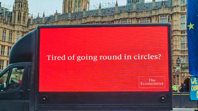 ‘Tired of going round in circles?’ 
The Economist marks another Brexit vote by driving a special message round (and round) Parliament Square